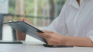 Financial analysts analyze business financial reports on a digital tablet planning investment project during a discussion at a meeting of corporate showing the results of their successful teamwork. video