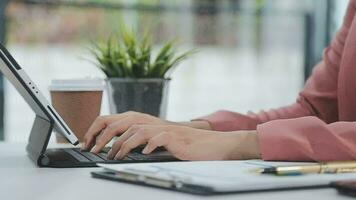 Financial analysts analyze business financial reports on a digital tablet planning investment project during a discussion at a meeting of corporate showing the results of their successful teamwork. video