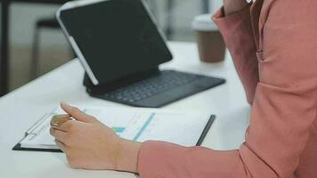 Financial analysts analyze business financial reports on a digital tablet planning investment project during a discussion at a meeting of corporate showing the results of their successful teamwork. video