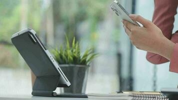 Financial analysts analyze business financial reports on a digital tablet planning investment project during a discussion at a meeting of corporate showing the results of their successful teamwork. video