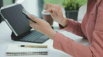 Financial analysts analyze business financial reports on a digital tablet planning investment project during a discussion at a meeting of corporate showing the results of their successful teamwork. video