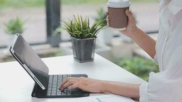 Financial analysts analyze business financial reports on a digital tablet planning investment project during a discussion at a meeting of corporate showing the results of their successful teamwork. video