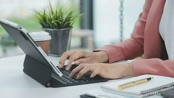 Financial analysts analyze business financial reports on a digital tablet planning investment project during a discussion at a meeting of corporate showing the results of their successful teamwork. video