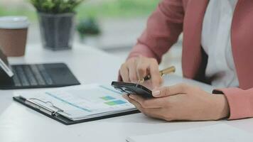 Financial analysts analyze business financial reports on a digital tablet planning investment project during a discussion at a meeting of corporate showing the results of their successful teamwork. video