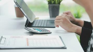 Financial analysts analyze business financial reports on a digital tablet planning investment project during a discussion at a meeting of corporate showing the results of their successful teamwork. video