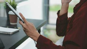 Financial analysts analyze business financial reports on a digital tablet planning investment project during a discussion at a meeting of corporate showing the results of their successful teamwork. video