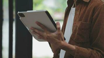 Financial analysts analyze business financial reports on a digital tablet planning investment project during a discussion at a meeting of corporate showing the results of their successful teamwork. video