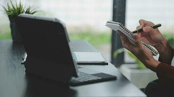 Financial analysts analyze business financial reports on a digital tablet planning investment project during a discussion at a meeting of corporate showing the results of their successful teamwork. video