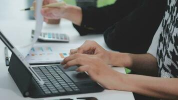 Financial analysts analyze business financial reports on a digital tablet planning investment project during a discussion at a meeting of corporate showing the results of their successful teamwork. video