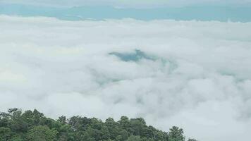 Mountain range with visible silhouettes through the morning blue fog. video