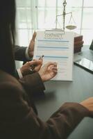 Judge gavel with Justice lawyers having team meeting at law firm background. Concepts of Law and Legal services. photo
