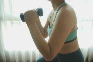 Close up image of attractive fit woman in gym photo