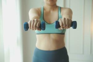 Close up image of attractive fit woman in gym photo
