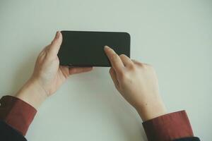 Woman hands holding and using cradit card for shopping online. photo