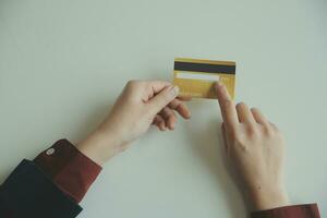 Woman hands holding and using cradit card for shopping online. photo