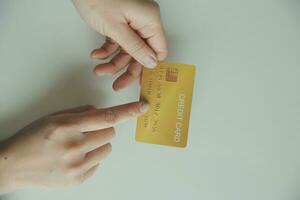 Woman hands holding and using cradit card for shopping online. photo