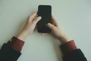 Woman hands holding and using cradit card for shopping online. photo