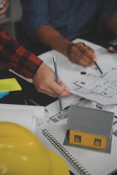 Engineer Teamwork Meeting, Drawing working on blueprint meeting for project working with partner on model building and engineering tools in working site, Construction and structure concept. photo