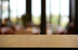 Empty wood table top and blur of out door garden background Empty wooden table space for text marketing promotion. blank wood table copy space for background photo