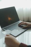 Woman hands holding and using cradit card for shopping online. photo