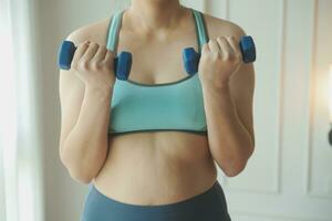 Close up image of attractive fit woman in gym photo