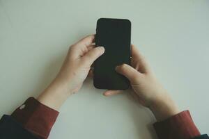 Woman hands holding and using cradit card for shopping online. photo