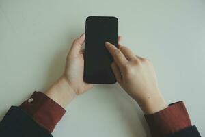 Woman hands holding and using cradit card for shopping online. photo