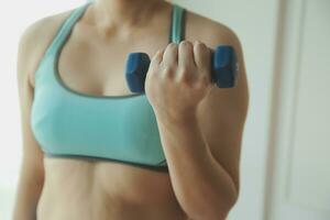 Close up image of attractive fit woman in gym photo