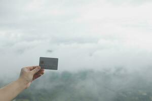 online payment, young woman holding credit card and touching on smartphone screen, copy space photo