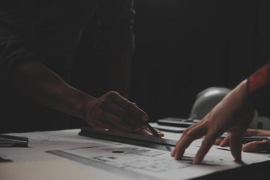 Engineer Teamwork Meeting, Drawing working on blueprint meeting for project working with partner on model building and engineering tools in working site, Construction and structure concept. photo