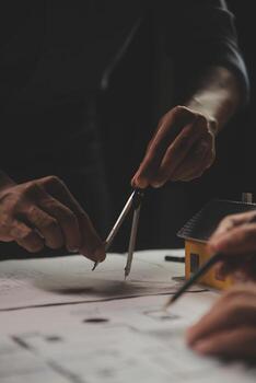 Engineer Teamwork Meeting, Drawing working on blueprint meeting for project working with partner on model building and engineering tools in working site, Construction and structure concept. photo