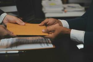 Business and lawyers discussing contract papers with brass scale on desk in office. Law, legal services, advice, justice and law concept picture with film grain effect photo