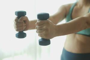 Close up image of attractive fit woman in gym photo