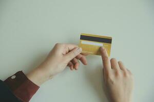 Woman hands holding and using cradit card for shopping online. photo