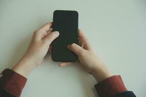 Woman hands holding and using cradit card for shopping online. photo