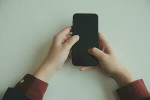 Woman hands holding and using cradit card for shopping online. photo