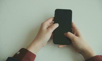 Woman hands holding and using cradit card for shopping online. photo