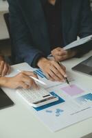 Financial Business team present. Business man hands hold documents with financial statistic stock photo, discussion, and analysis report data the charts and graphs. Finance Financial concept photo