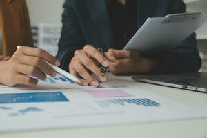 Financial Business team present. Business man hands hold documents with financial statistic stock photo, discussion, and analysis report data the charts and graphs. Finance Financial concept photo