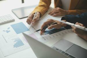 Financial Business team present. Business man hands hold documents with financial statistic stock photo, discussion, and analysis report data the charts and graphs. Finance Financial concept photo