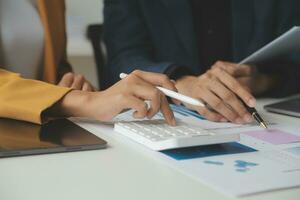 Financial Business team present. Business man hands hold documents with financial statistic stock photo, discussion, and analysis report data the charts and graphs. Finance Financial concept photo