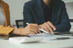 Financial Business team present. Business man hands hold documents with financial statistic stock photo, discussion, and analysis report data the charts and graphs. Finance Financial concept photo