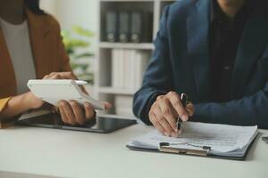 Financial Business team present. Business man hands hold documents with financial statistic stock photo, discussion, and analysis report data the charts and graphs. Finance Financial concept photo