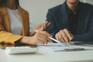 Financial Business team present. Business man hands hold documents with financial statistic stock photo, discussion, and analysis report data the charts and graphs. Finance Financial concept photo