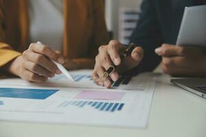 Financial Business team present. Business man hands hold documents with financial statistic stock photo, discussion, and analysis report data the charts and graphs. Finance Financial concept photo