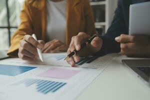 Financial Business team present. Business man hands hold documents with financial statistic stock photo, discussion, and analysis report data the charts and graphs. Finance Financial concept photo