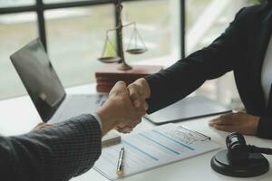 female lawyers working at the law firms. Judge gavel with scales of justice. Legal law, lawyer, advice and justice concept. photo