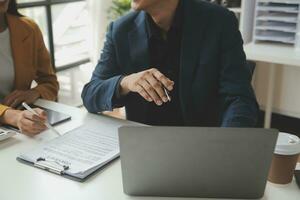 Financial Business team present. Business man hands hold documents with financial statistic stock photo, discussion, and analysis report data the charts and graphs. Finance Financial concept photo