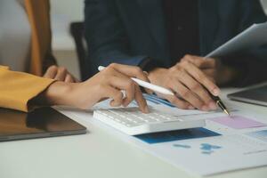 Financial Business team present. Business man hands hold documents with financial statistic stock photo, discussion, and analysis report data the charts and graphs. Finance Financial concept photo