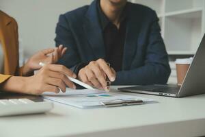Financial Business team present. Business man hands hold documents with financial statistic stock photo, discussion, and analysis report data the charts and graphs. Finance Financial concept photo